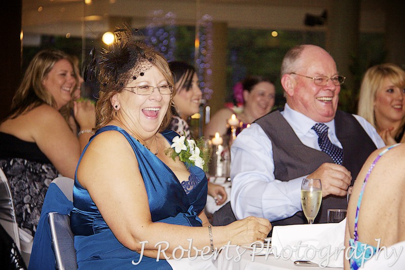 Mother of bride laughing during speeches - wedding photography sydney